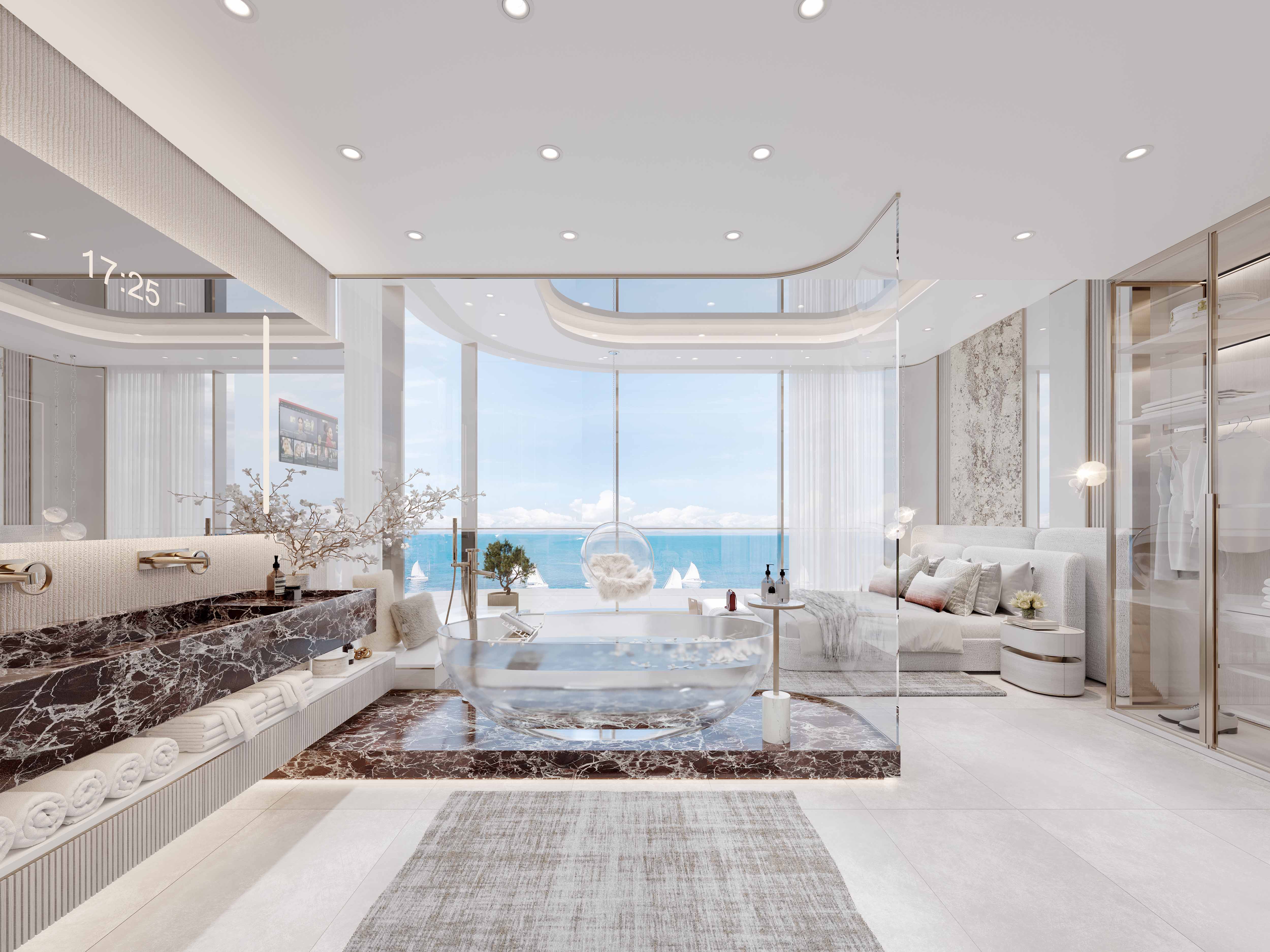 Cotier House 2 By Imtiaz A luxurious bathroom with modern design, featuring a glass-enclosed tub and stunning ocean views through large windows.